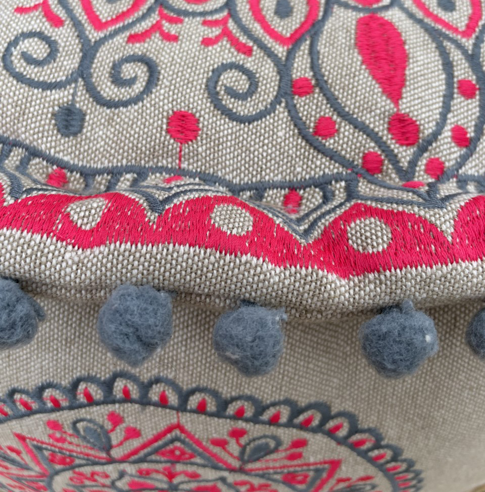 Pink and grey-blue mandala patterned pouffe or low seat with pretty mini pom-pom trim