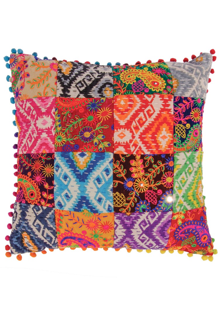 Multi-coloured cushion with patch embroidered detail and pom-pom edging.