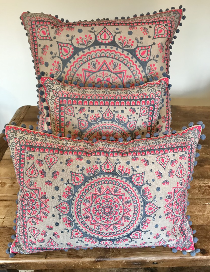 Pink and grey mandala design cushion with grey mini pom pom edging, in three sizes