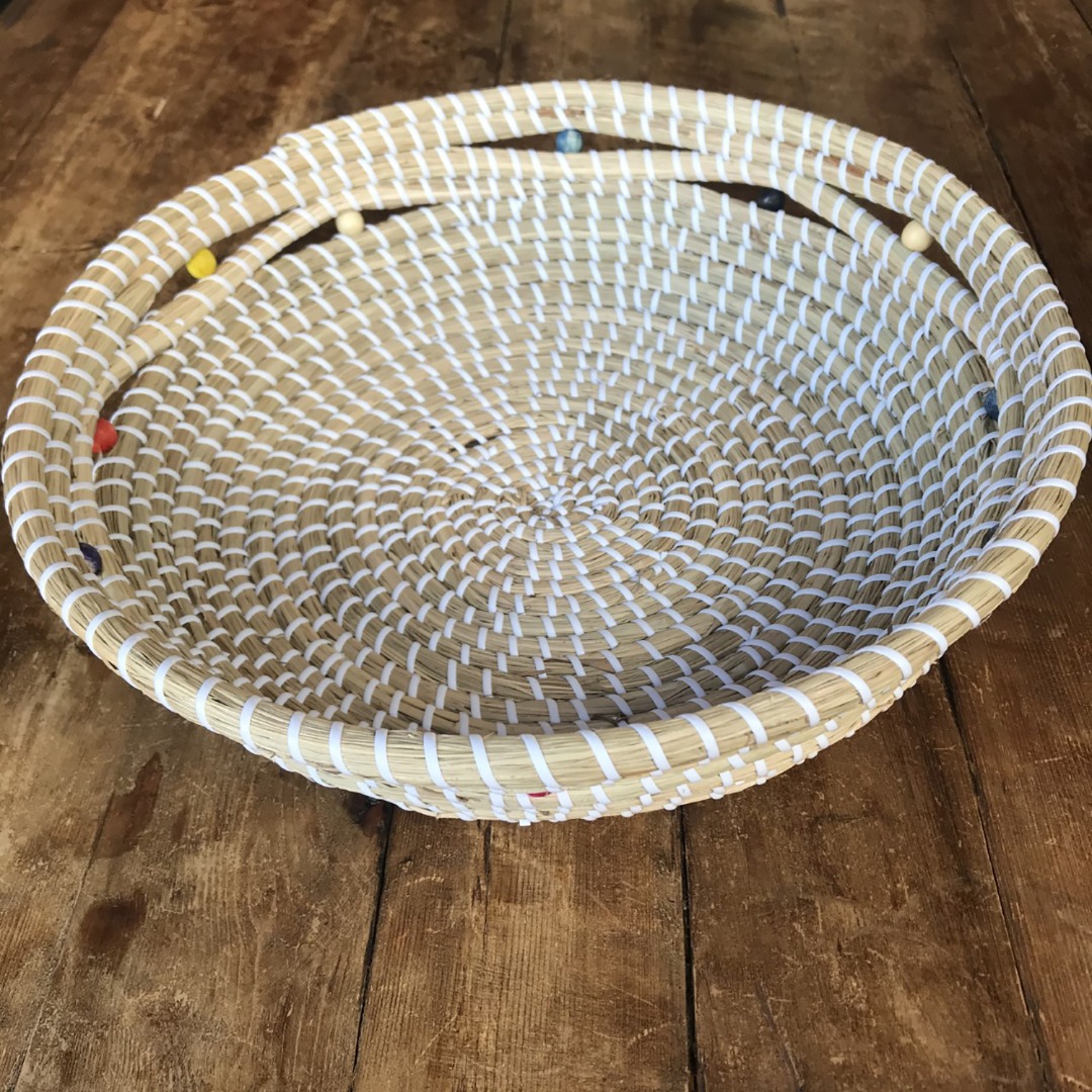 Natural hardwearing seagrass fruit or bread basket with decorative coloured wooden beads