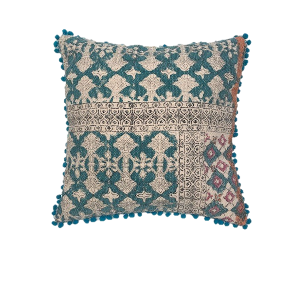 Turquoise square patterned cushion with pom pom edging and block print design with a splash of orange and dusky pink