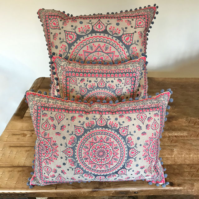 Pink and grey mandala design cushion with grey mini pom pom edging, in three sizes