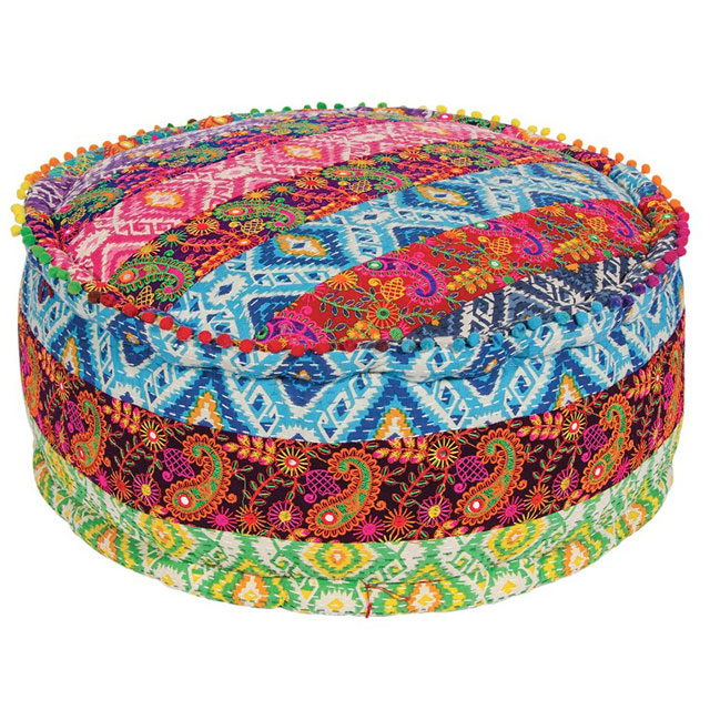 Multi-coloured Pouffe or footstool with patch embroidered detail and pom-pom edging to the seat.